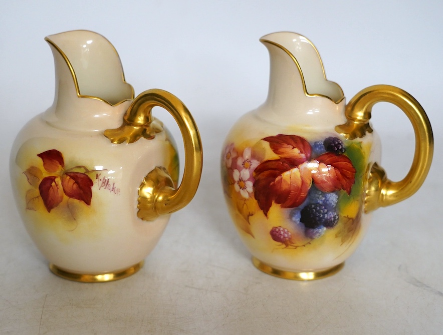 Kitty Blake for Royal Worcester, a pair of porcelain ewers, hand painted with autumn leaves and berries, shape 1094, 11cm. Condition - good